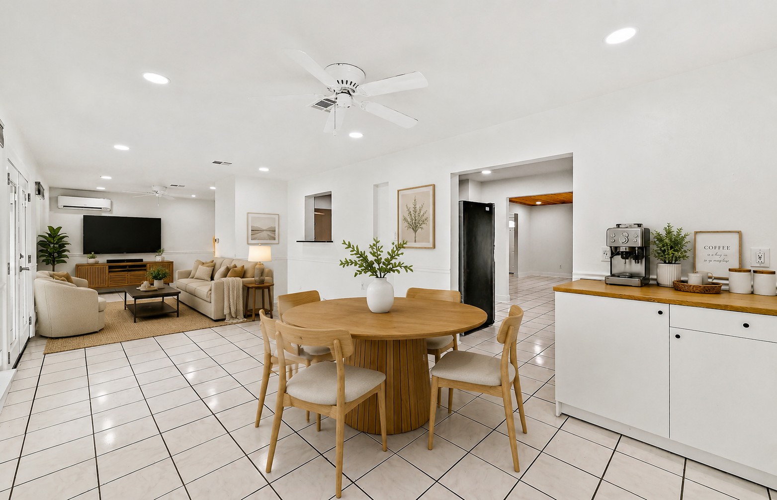 Open den and dining area with coffee bar