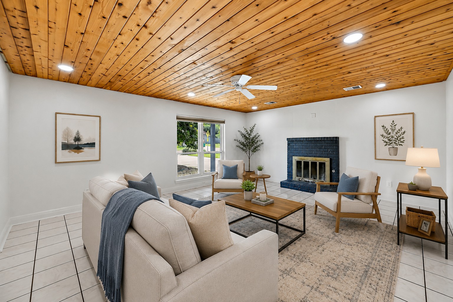 Living room with navy brick fireplace